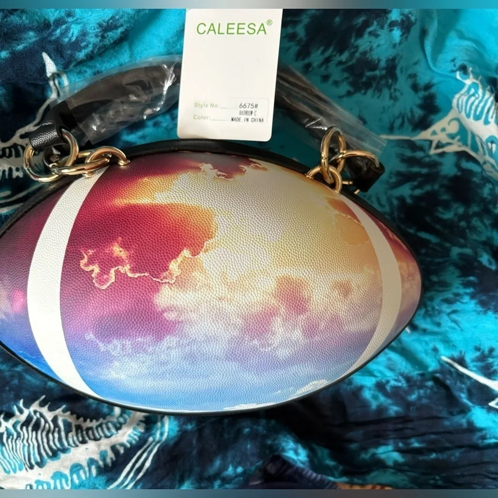NWT-whimsical tie-dyed clouds  Pristine pebbled Rugby football purse gold chain
